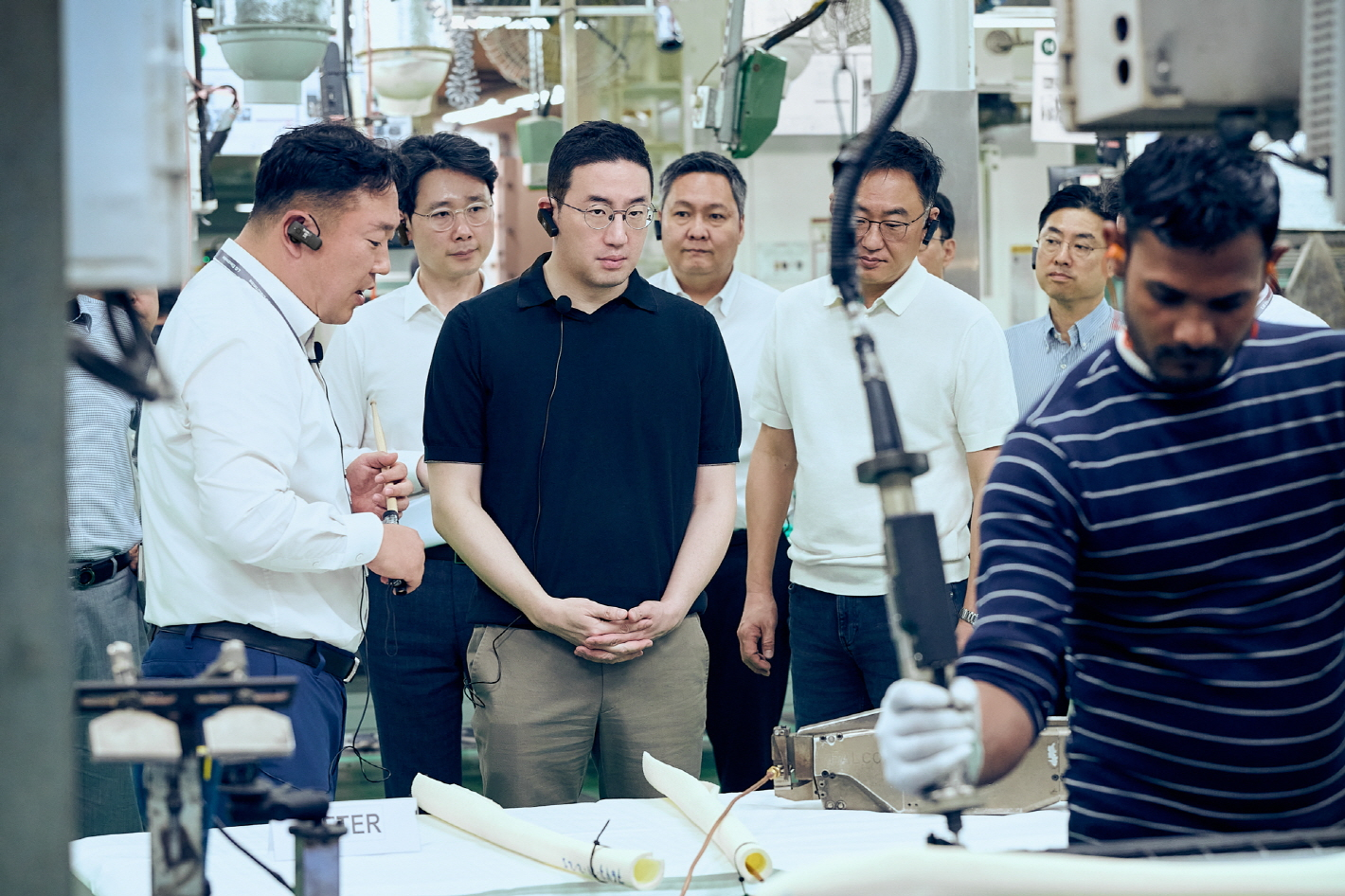 LG Chairman Koo Kwang-mo, second from left in the front row, visits LG Electronics' Noida manufacturing plant in New Delhi, India, to observe the air conditioner production process. [LG]