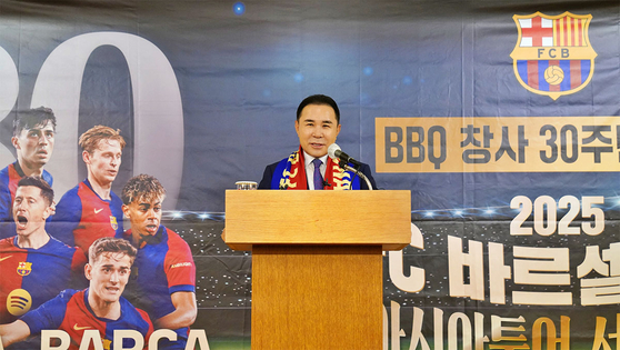 Genesis BBQ Chairman Yoon Hong-geun speaks at a press briefing commemorating the chicken franchise's upcoming 30th anniversary and sponsorship for FC Barcelona's friendly match against FC Seoul in Korea's capital city on July 31. [GENESIS BBQ]