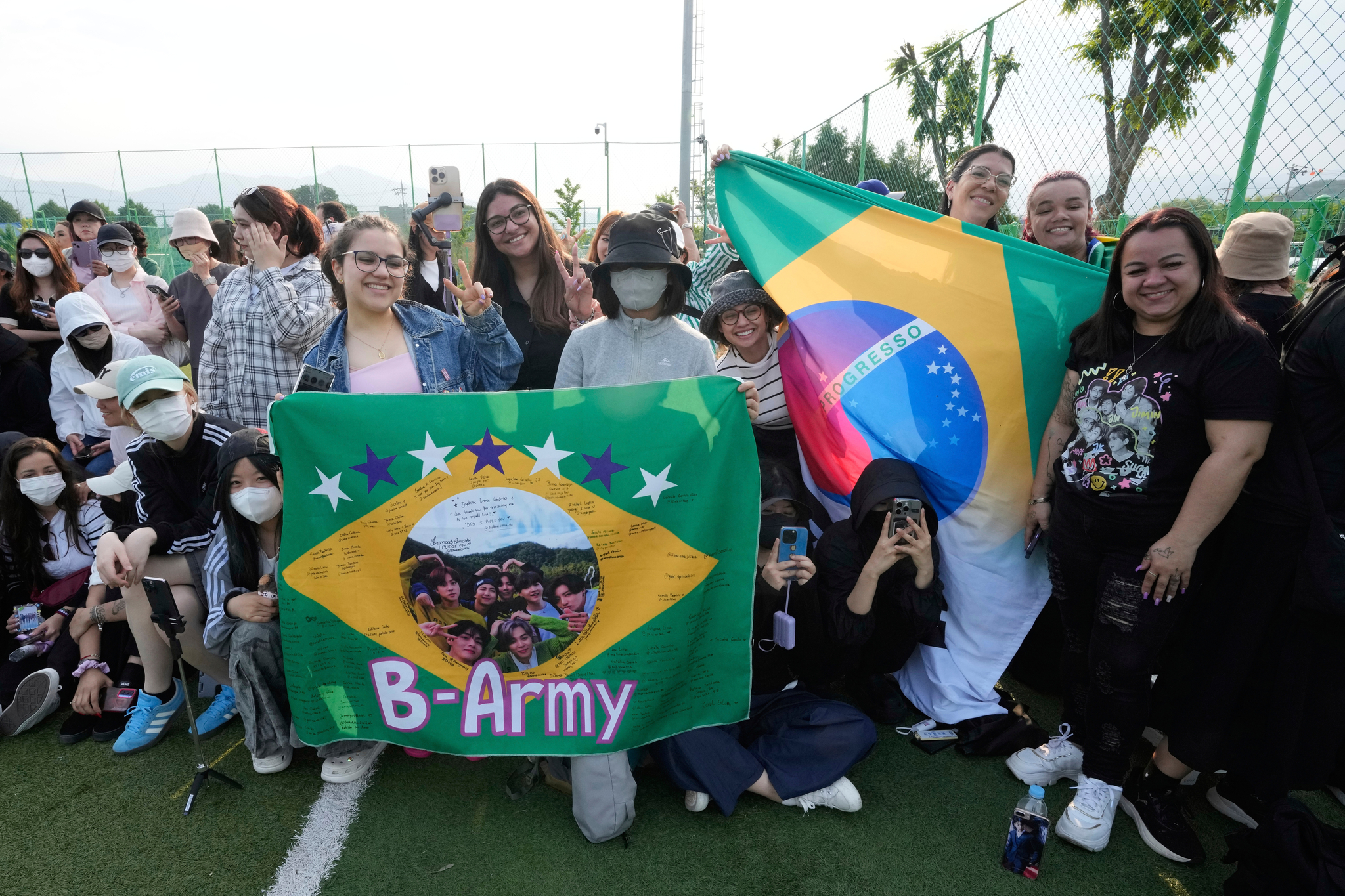 Fans wait for the arrival of K-pop band BTS members RM and V before they are discharged from a mandatory military service in Chuncheon, Gangwon, on June 10, 2025. [AP/YONHAP]