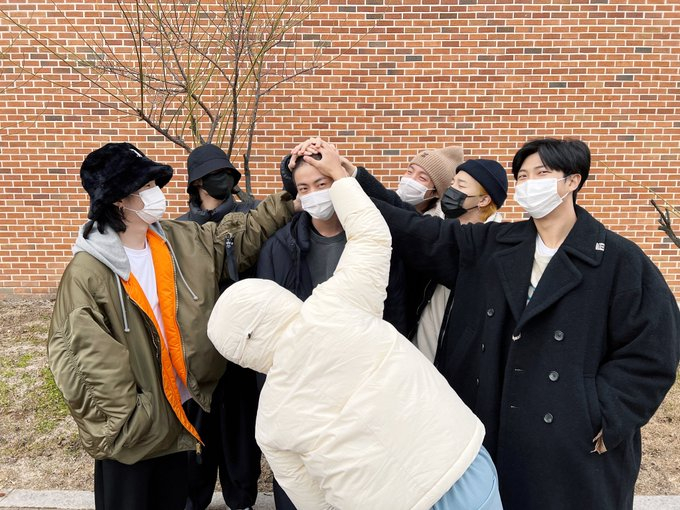BTS members pose for the camera as they support Jin in a photo posted on Dec. 13, 2022, the day that Jin began his military service. [BIGHIT MUSIC/SCREEN CAPTURE]