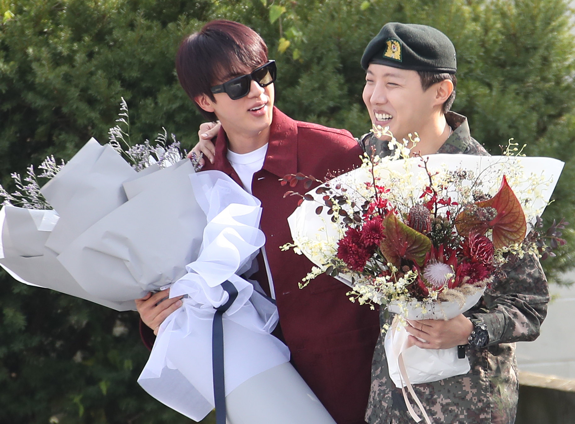 BTS member Jin, left, greets J-Hope as the latter finishes his military duty on Oct. 17, 2024 in Wonju, Gangwon. [NEWS1]