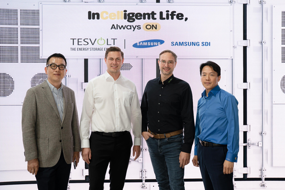 Officials from Samsung SDI and Tesvolt pose for photos at the Samsung SDI booth set up inside InterBattery Europe 2025. [SAMSUNG SDI]