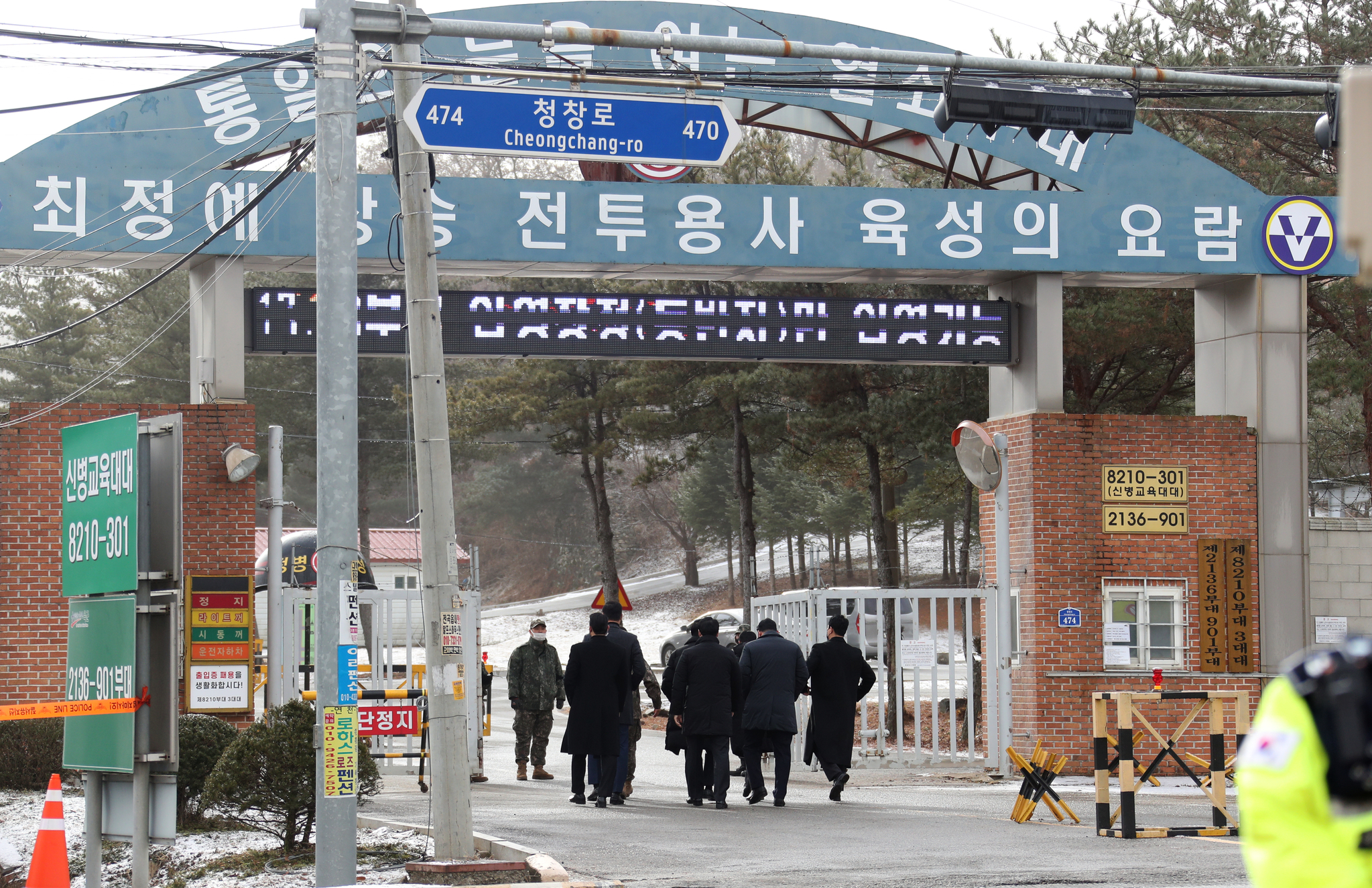 A security team for BTS member Jin is seen at the ROK Army 5th Infantry Division Recruit Training Center in Yeoncheon County, Gyeonggi, on Dec. 13, 2022, the day of his enlistment. [NEWS1]