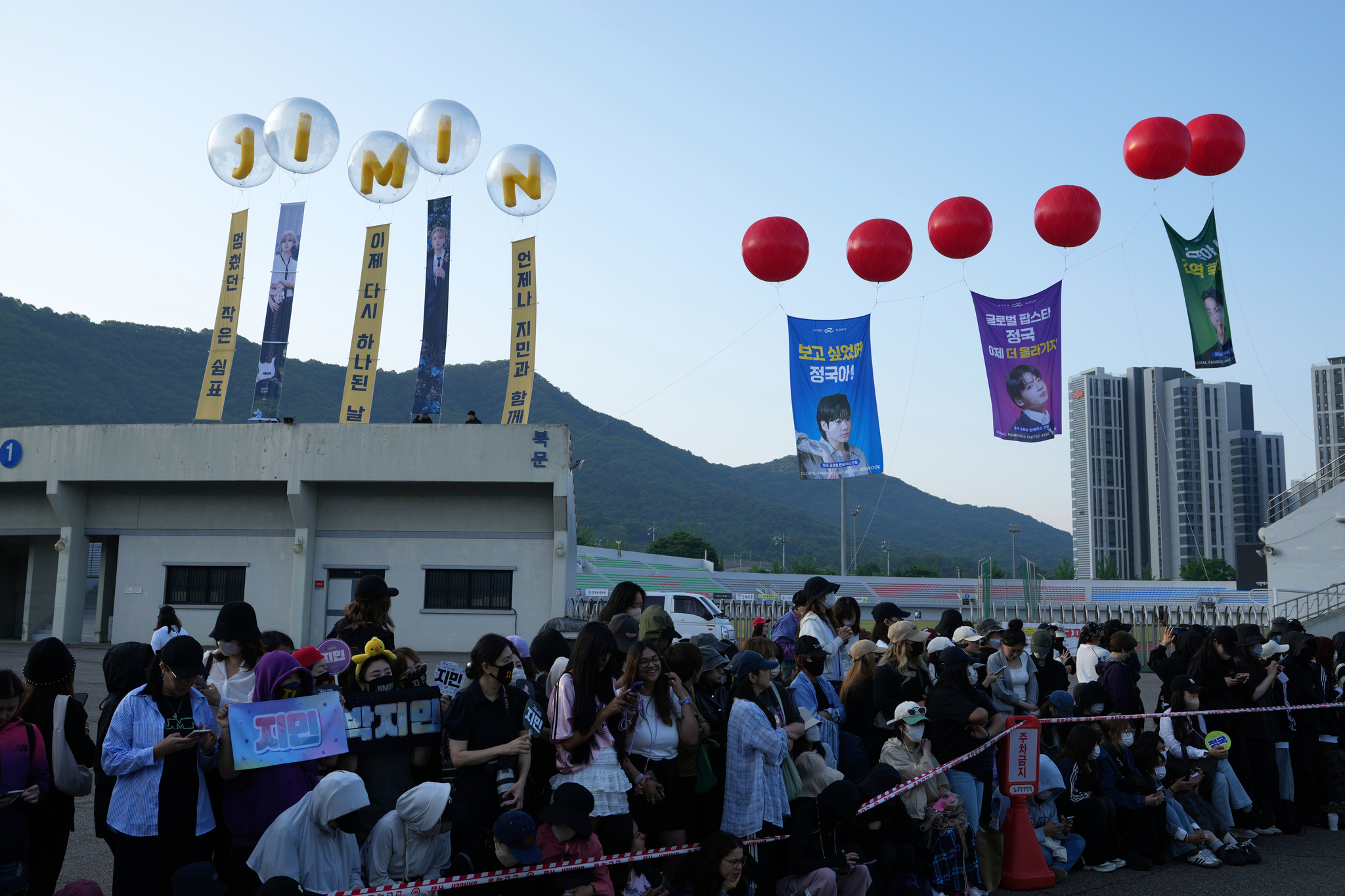 Fans wait for the arrival of K-pop band BTS members Jimin and Jungkook in Yeoncheon, Gyeonggi, on June 11, 2025. [AP/YONHAP]