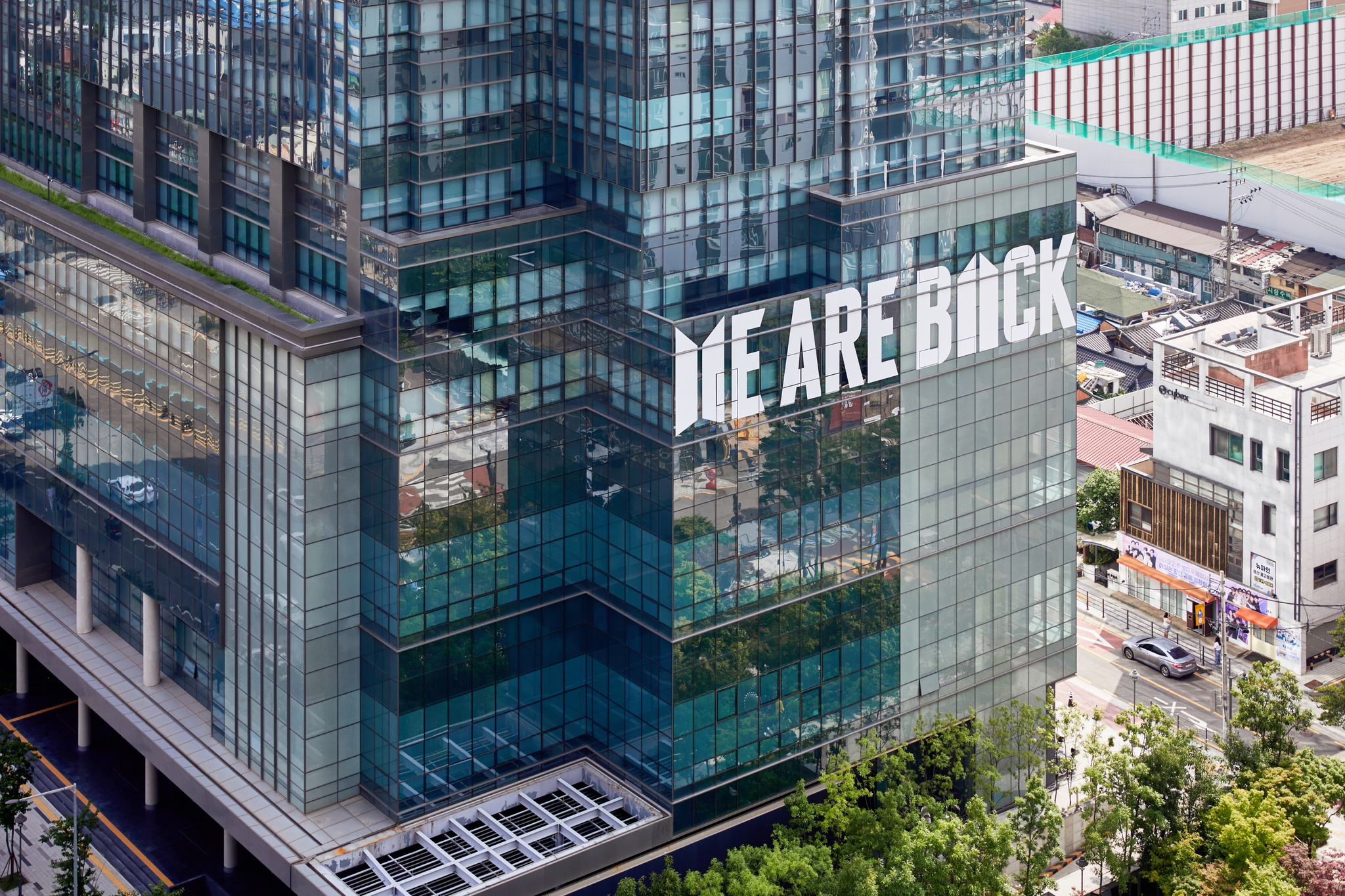 HYBE headquarters in Yongsan District, central Seoul, his seen plastered with the words "We Are Back" in celebration of boy band BTS's 12th year since its debut as all members return from their mandatory military service in June. The decoration will be hung up from June 9 to June 29. [BIGHIT MUSIC]