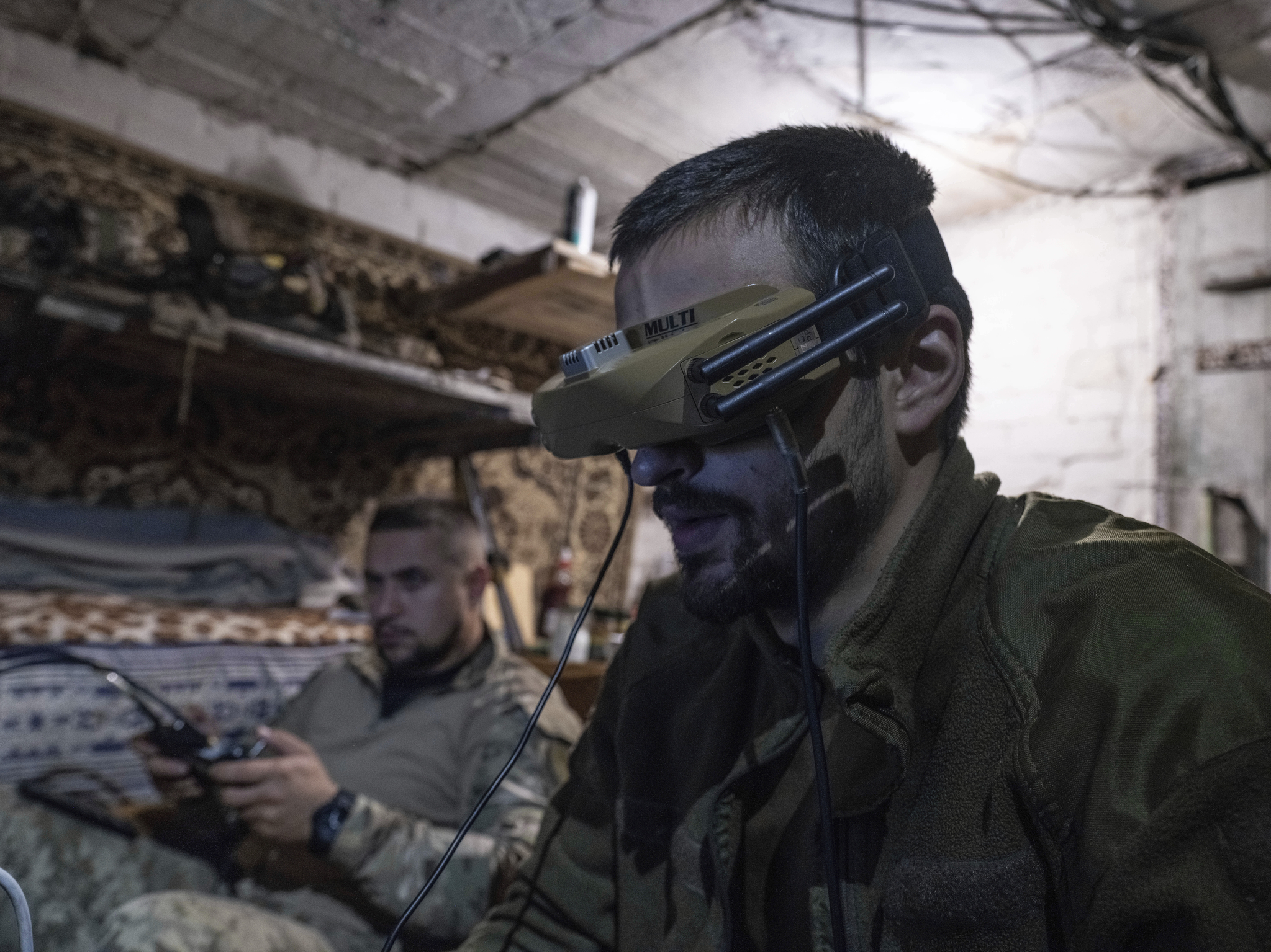In this photo provided by Ukraine's 93rd Kholodnyi Yar Separate Mechanized Brigade press service, soldiers use drones to fire on Russian positions from a shelter in Kostyantynivka, Donetsk region, Ukraine, on May 23. [AP/YONHAP] 