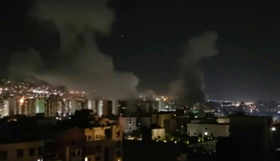This image grab taken from UGC footage broadcast by Iran TV on June 13 shows what the television described as smoke billowing from explosions after Israel announced it had carried out strikes on Iranian nuclear and military sites in the Islamic republic. [AFP/YONHAP]