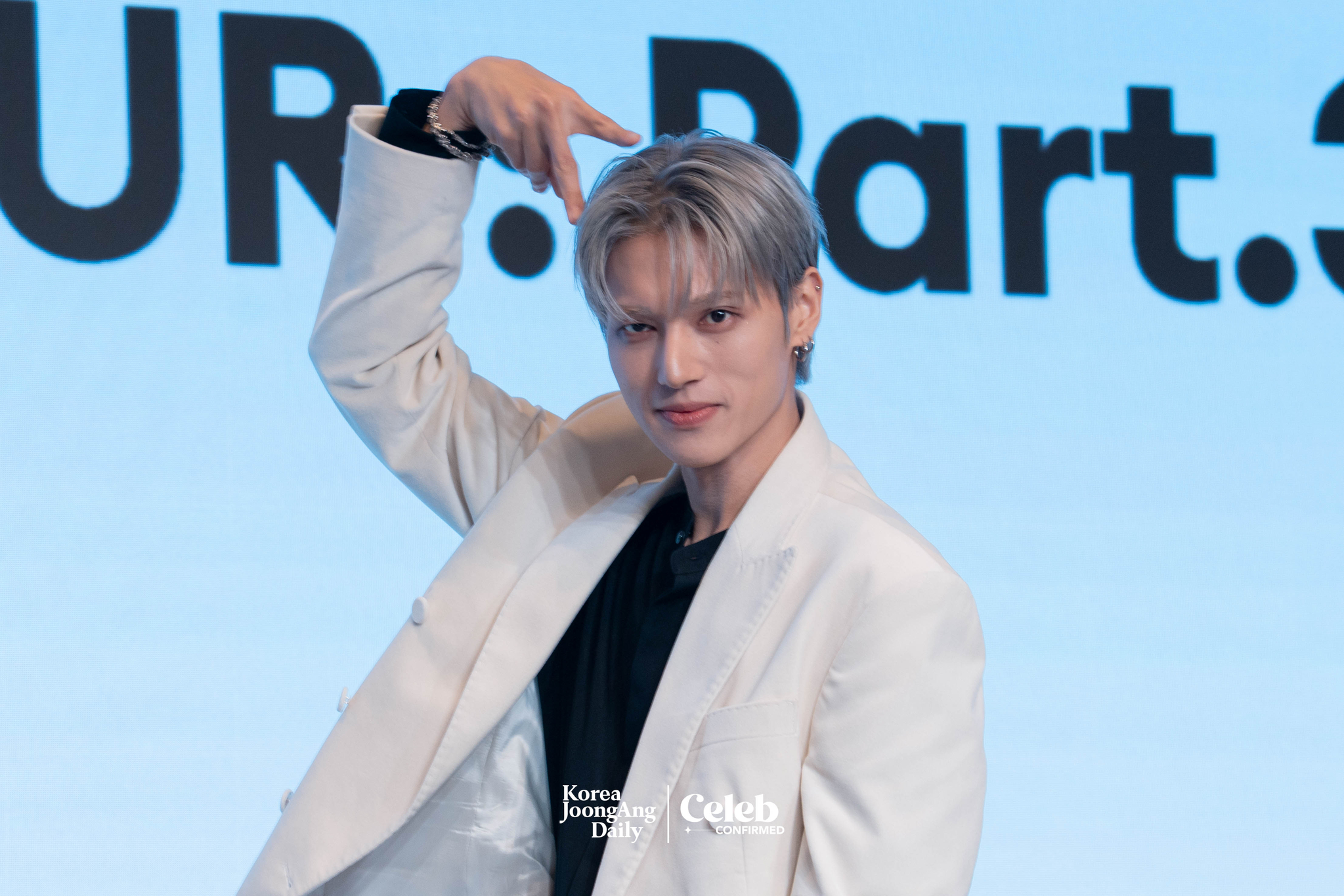 Ateez’s Wooyoung poses for photos during a news conference for the release of its 12th EP, “Golden Hour: Part.3,” at Hotel Naru Seoul MGallery Ambassador in western Seoul. [DANIELA GONZALEZ PEREZ]
