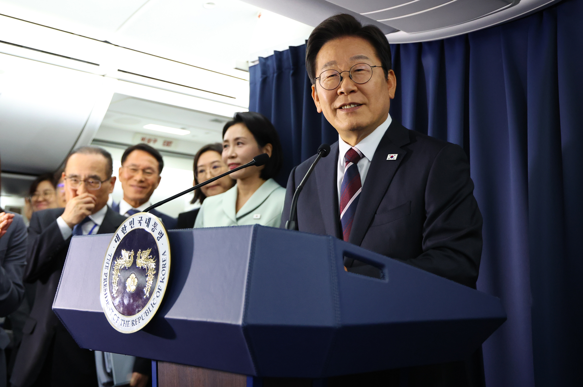 President Lee Jae Myung speaks to reporters at a press briefing on a presidential flight en route to the Group of 7 summit in Canada on June 16. [JOINT PRESS CORPS]