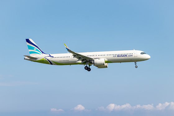 An Air Busan passenger plane is seen flying over Busan on Aug. 14, 2024. [YONHAP] 