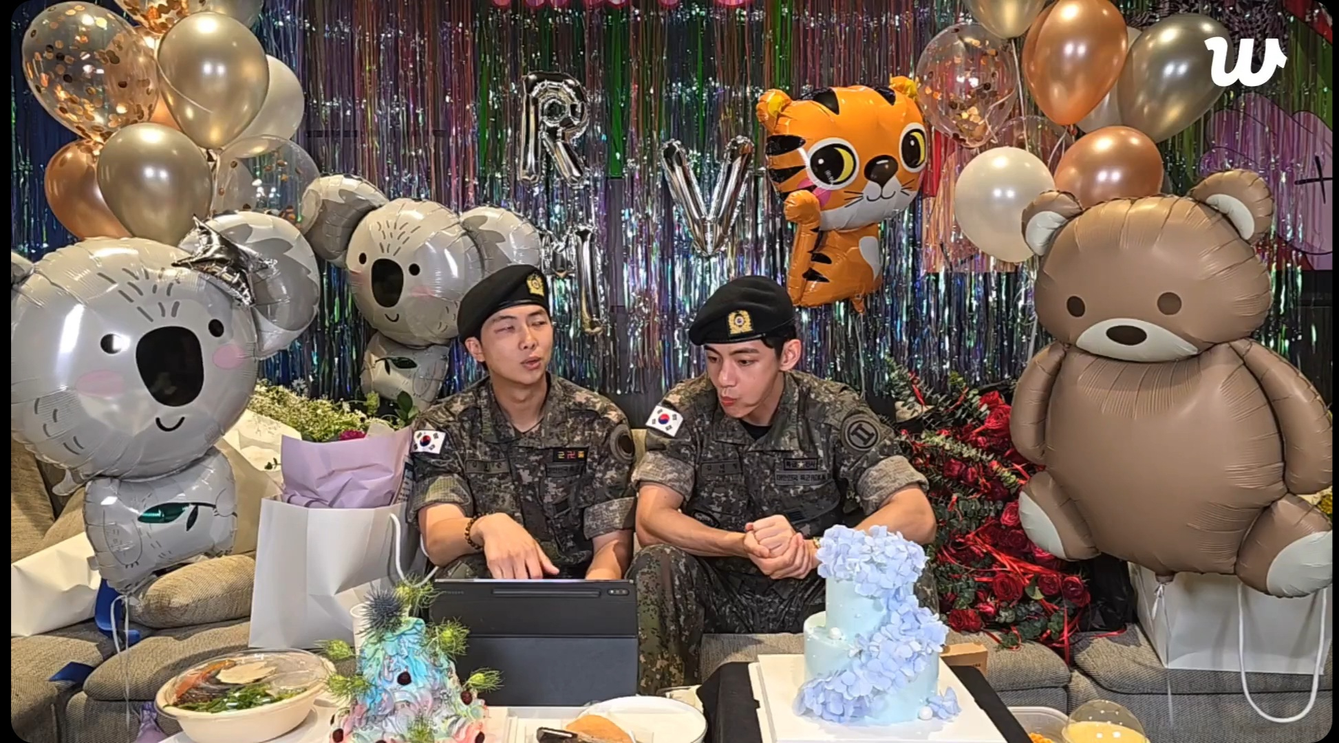 BTS members RM, left, and V during a livestream on fan community platform Weverse on June 10, the day they were discharged from their military duties [SCREEN CAPTURE]
