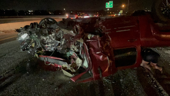 A vehicle involved in the crash lies overturned on Interstate 76 near Denver on June 13 at 10:50 p.m. The rear of the vehicle is completely destroyed, and none of the four doors are open. [NATIONAL FIRE AGENCY] 