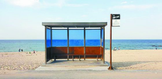 A replica of a bus stop featured on the cover of the BTS album ″You Never Walk Alone″ (2017), along Jumunjin Beach in Gangneung, Gangwon. Valeria's tour group recently visited the site for its BTS-themed trip. [KOREA TOURISM ORGANIZATION]