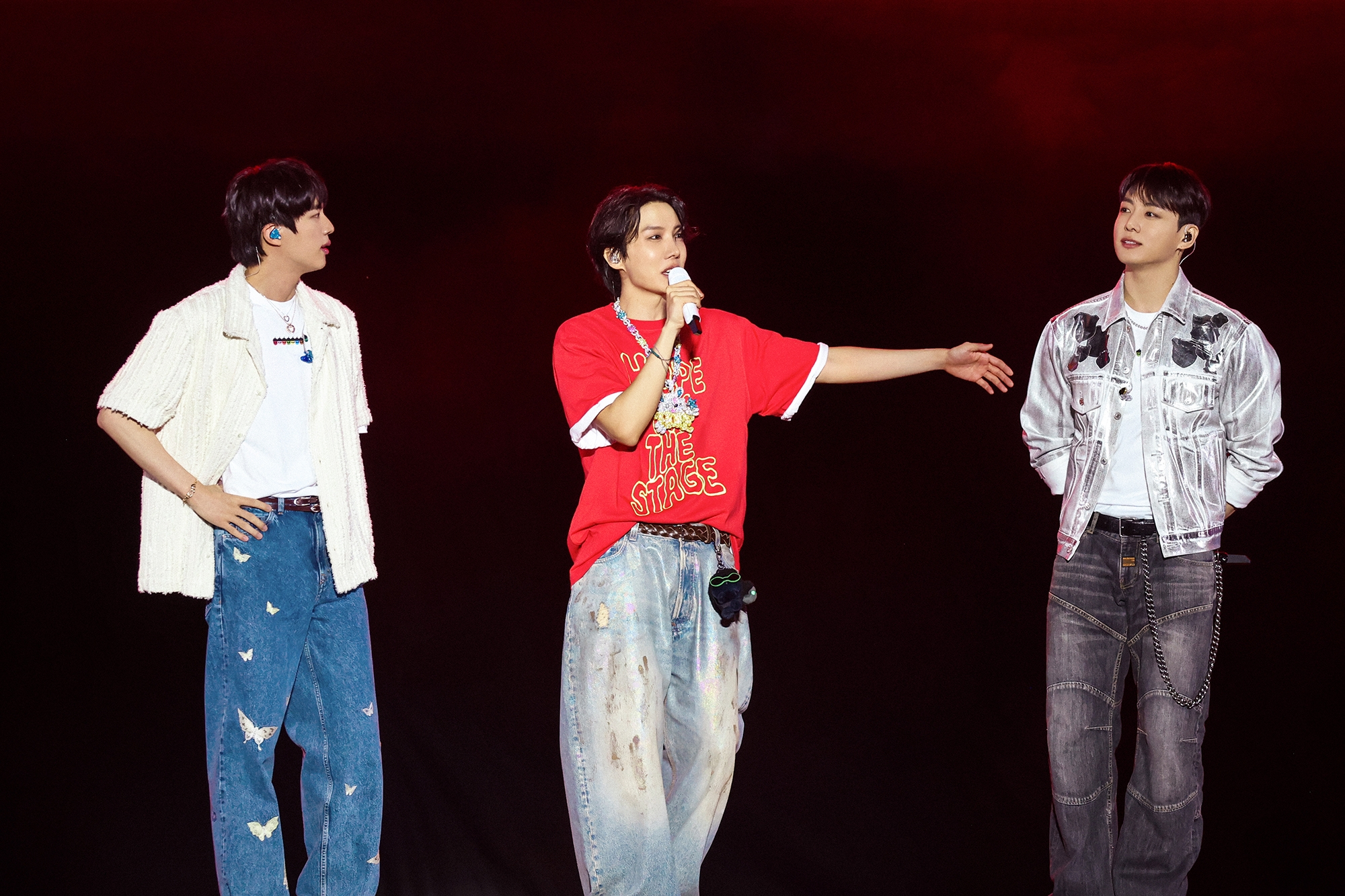 BTS members Jin, left, and Jungkook, right, made a special appearance onstage during J-Hope’s solo concert in Goyang, Gyeonggi, on June 13. [BIGHIT MUSIC]