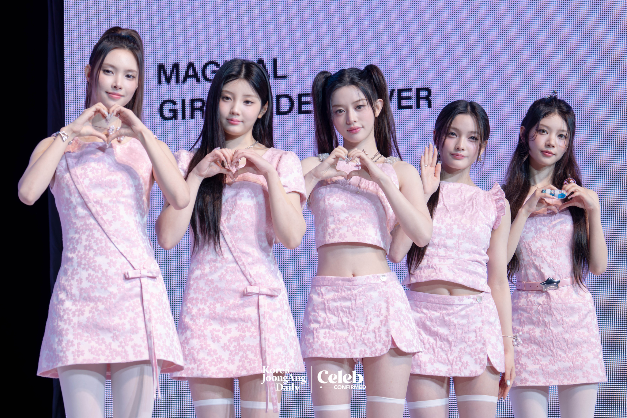 Girl group ILLIT poses for photos during a showcase for the release of its 3rd EP, “bomb,” at Yes24 Live Hall in eastern Seoul on June 16. [DANIELA GONZALEZ PEREZ]