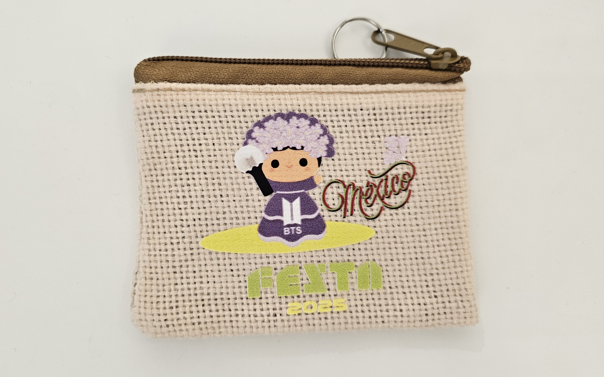 A purse made by Mitzy Minerva, a Mexican BTS fan, featuring an ARMY-themed lele, a traditional Mexican doll, designed by Minerva [SHIN HA-NEE]