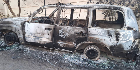 A handout photo made available by Iranian Red Crescent Society (IRCS) shows a damaged IRCS ambulance following an Israeli airstrike, in Tehran, Iran, on June 16, 2025 (issued 17 June 2025). The IRCS said three aid workers were killed in the attack. Israel has continued its strikes across Iran since 13 June, targeting nuclear and energy facilities, and a state television building in Tehran. In response, Iran launched waves of retaliatory missiles and drones toward Israel. [EPA/YONHAP]