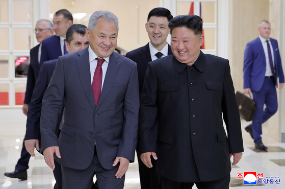 North Korean leader Kim Jong-un walks with Secretary of Russia's Security Council Sergei Shoigu during their meeting in Pyongyang on June 17. [YONHAP]