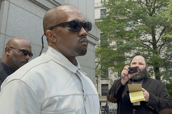 Ye, the rapper formerly known as Kanye West, leaves federal court during the trial of Sean ″Diddy″ Combs in New York, June 13. [AP/YONHAP]