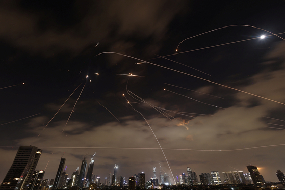 Missiles launched from Iran are intercepted as seen from Tel Aviv, Israel, June 16, 2025. [REUTERS/YONHAP]