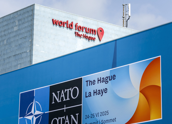Security cameras overlook the area near the World Forum hosting the upcoming NATO summit in The Hague on June 19.[AFP/YONHAP]