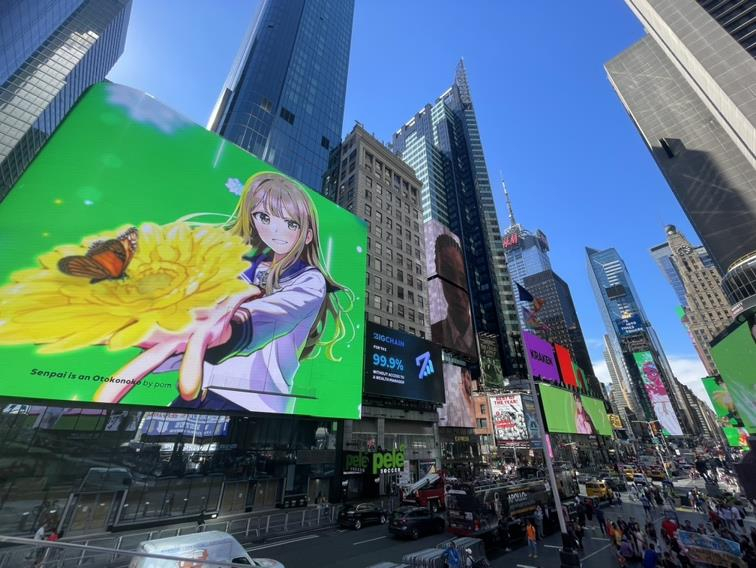 Webtoon Entertainment, the parent company of Naver Webtoon, was listed on the Nasdaq, on June 27, 2024. Pictured is an ad in New York’s Times Square featuring the Japanese webtoon series ″Senpai is an Otokonoko″ (2023-25), one of the company’s flagship titles. [NAVER WEBTOON]