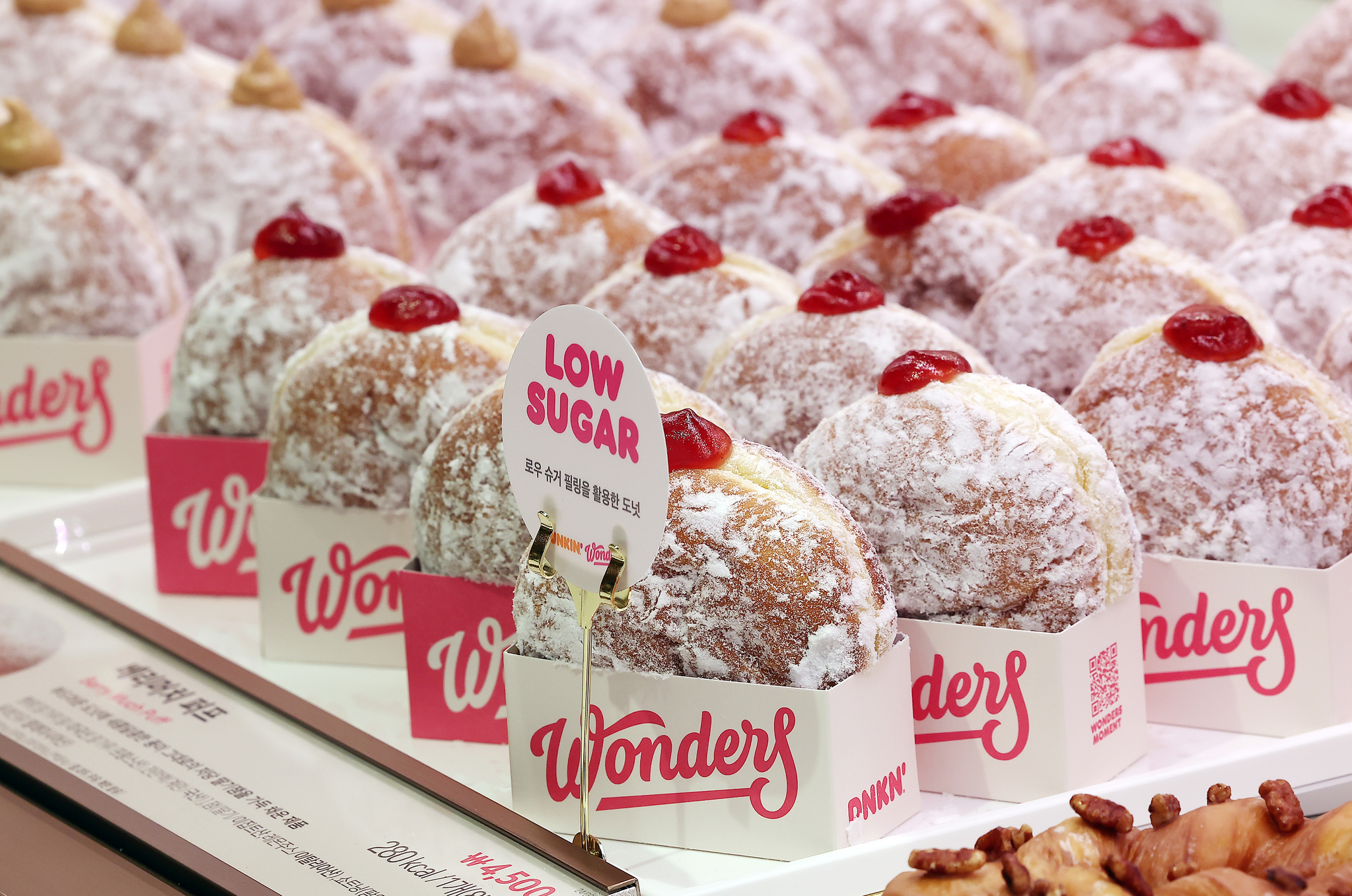 Dunkin' Korea's low-sugar jam donuts, launched as part of the franchise's ″Wonders″ project, are on display at Dunkin's newly rebranded Wonders store in Cheongdam-dong, southern Seoul, on Sept. 10, 2024. [NEWS1]