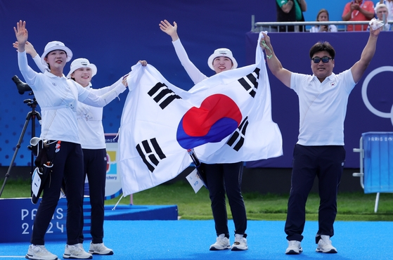 Korea celebrate after winning the women's team archery gold medal match against China at the Invalides in Paris on July 28, 2024. [EPA/YONHAP]