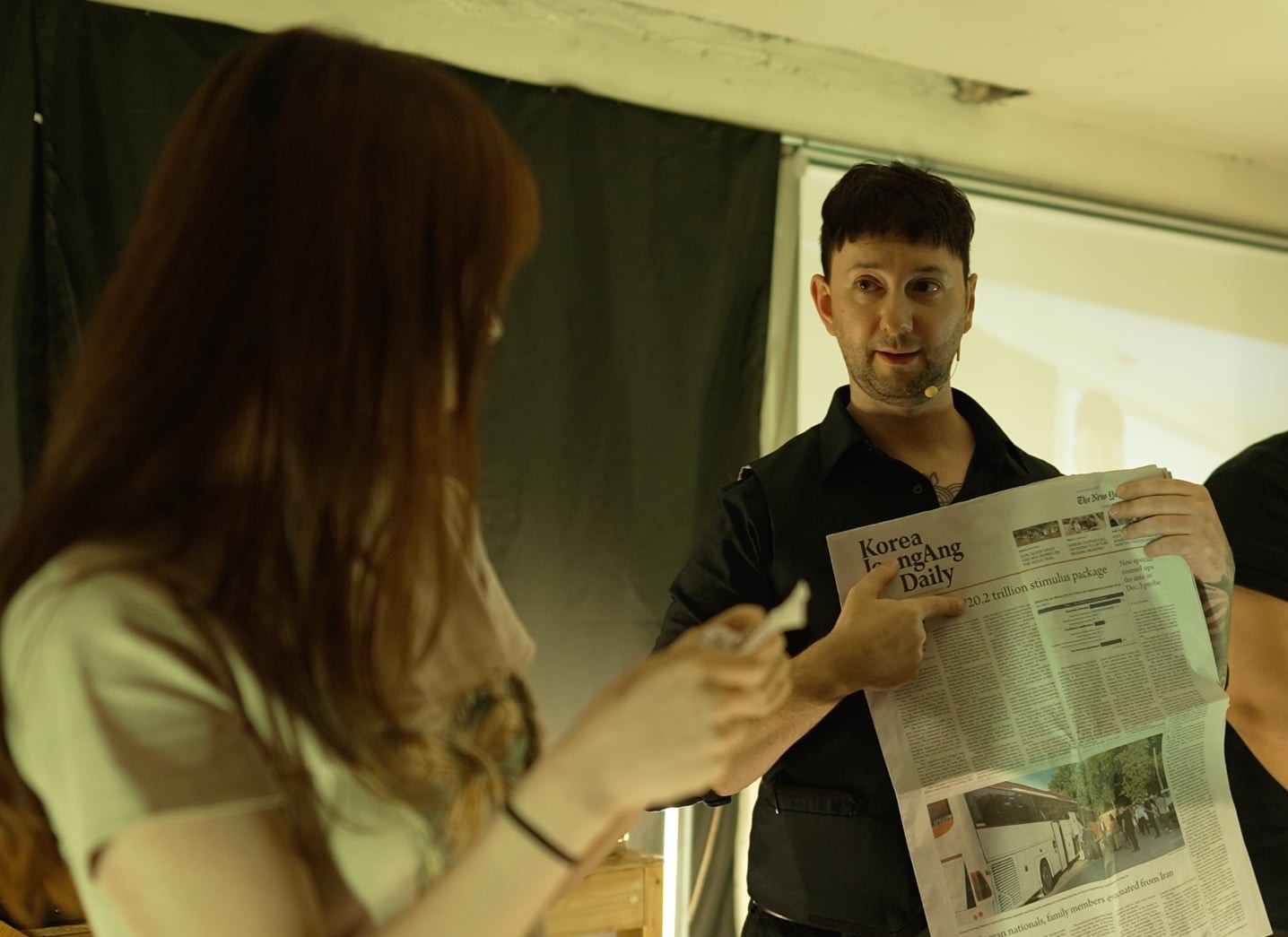 Mind reader Joel Bentley holds the newspaper whose front page he attempted to predict. [JOEL BENTLEY]