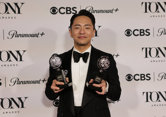 Hue Park poses with the Best Score award and Best Book of a Musical award for ″Maybe Happy Ending″ at the 78th Annual Tony Awards in New York City on June 8. [REUTERS/YONHAP]