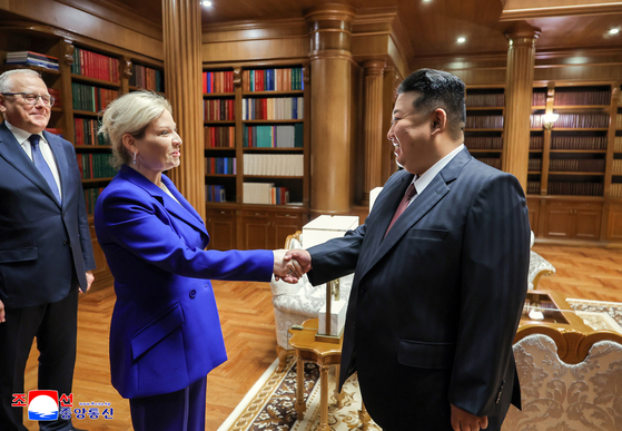 North Korean leader Kim Jong-un, right, shakes hands with Russia's Culture Minister Olga Lyubimova in Pyongyang on June 29. [YONHAP] 