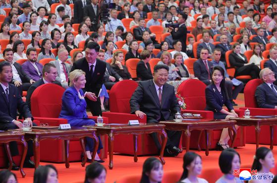 North Korean leader Kim Jong-un, center, is seated between Russia's Culture Minister Olga Lyubimova and his daughter during an art performance in Pyongyang on June 29. [YONHAP] 