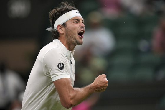 Taylor Fritz of the United States reacts during his first round men's single match against Giovanni Mpetshi Perricard of France at the Wimbledon Tennis Championships in London, June 30. [AP/YONHAP]