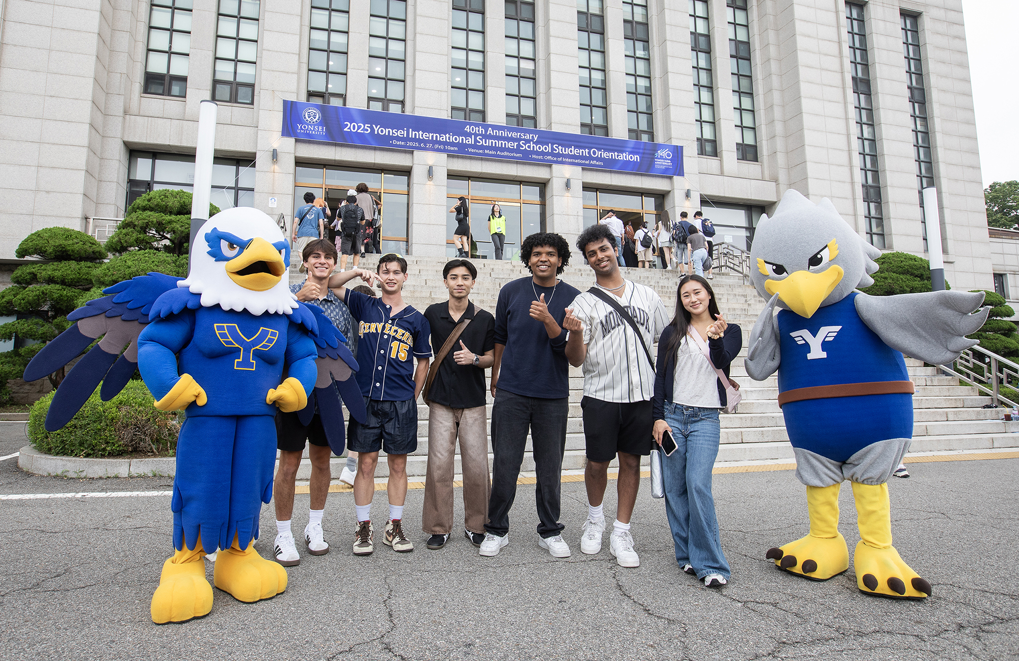 Students participating in the Yonsei International Summer School take a photo with the university's mascot Yonsuri during an orientation held June 27. [YONSEI UNIVERSITY]