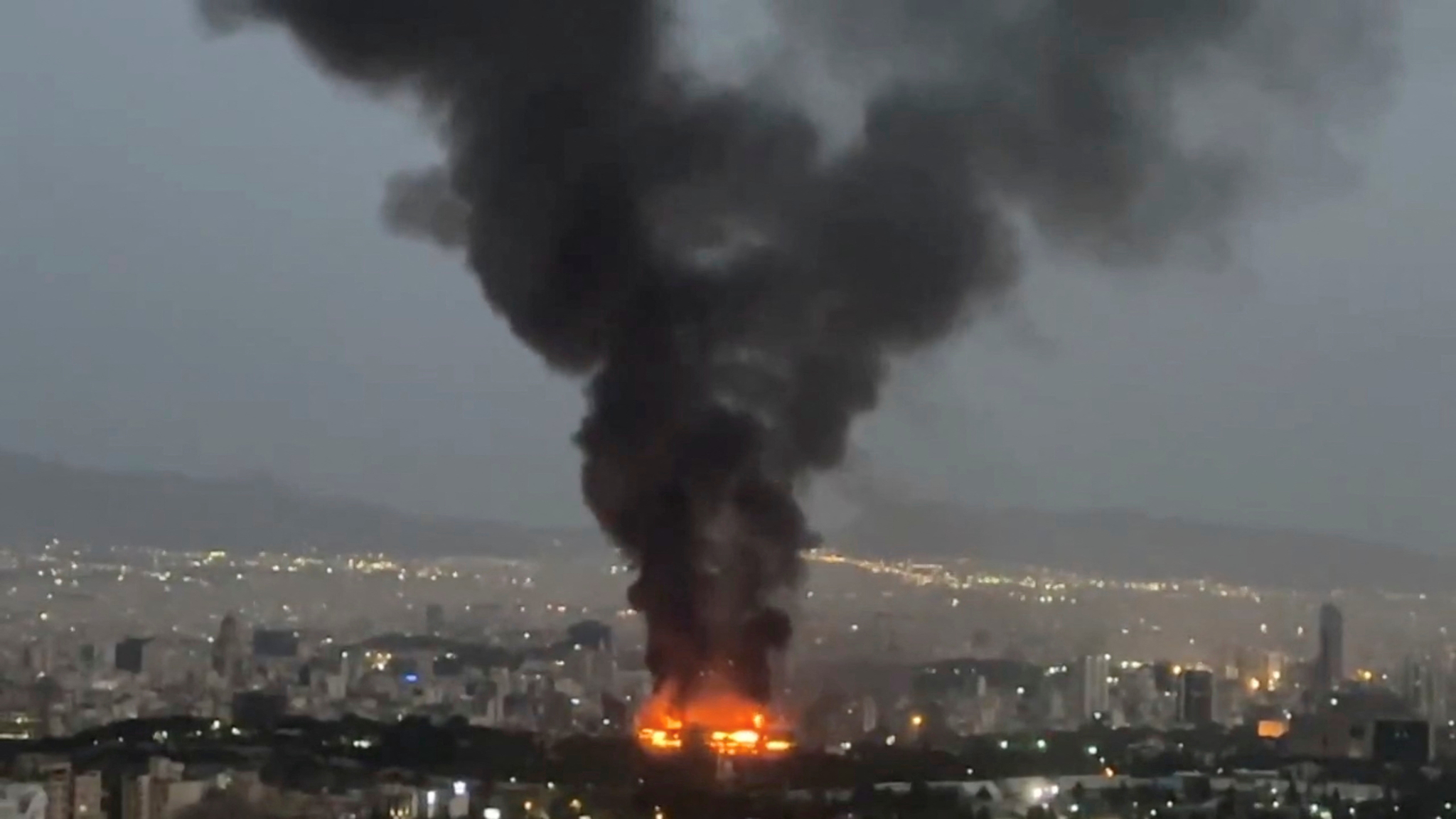 Smoke rises from a fire as the Israel-Iran air war continues in Tehran in this still image obtained from a social media video posted on June 17. [REUTERS/YONHAP]