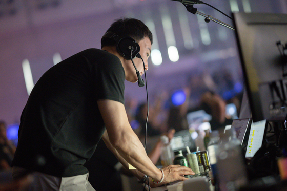BEPC Tangent CEO Kim monitors the festival on screens fed by eight camera angles, signaling cues throughout the show. [BEPC TANGENT]