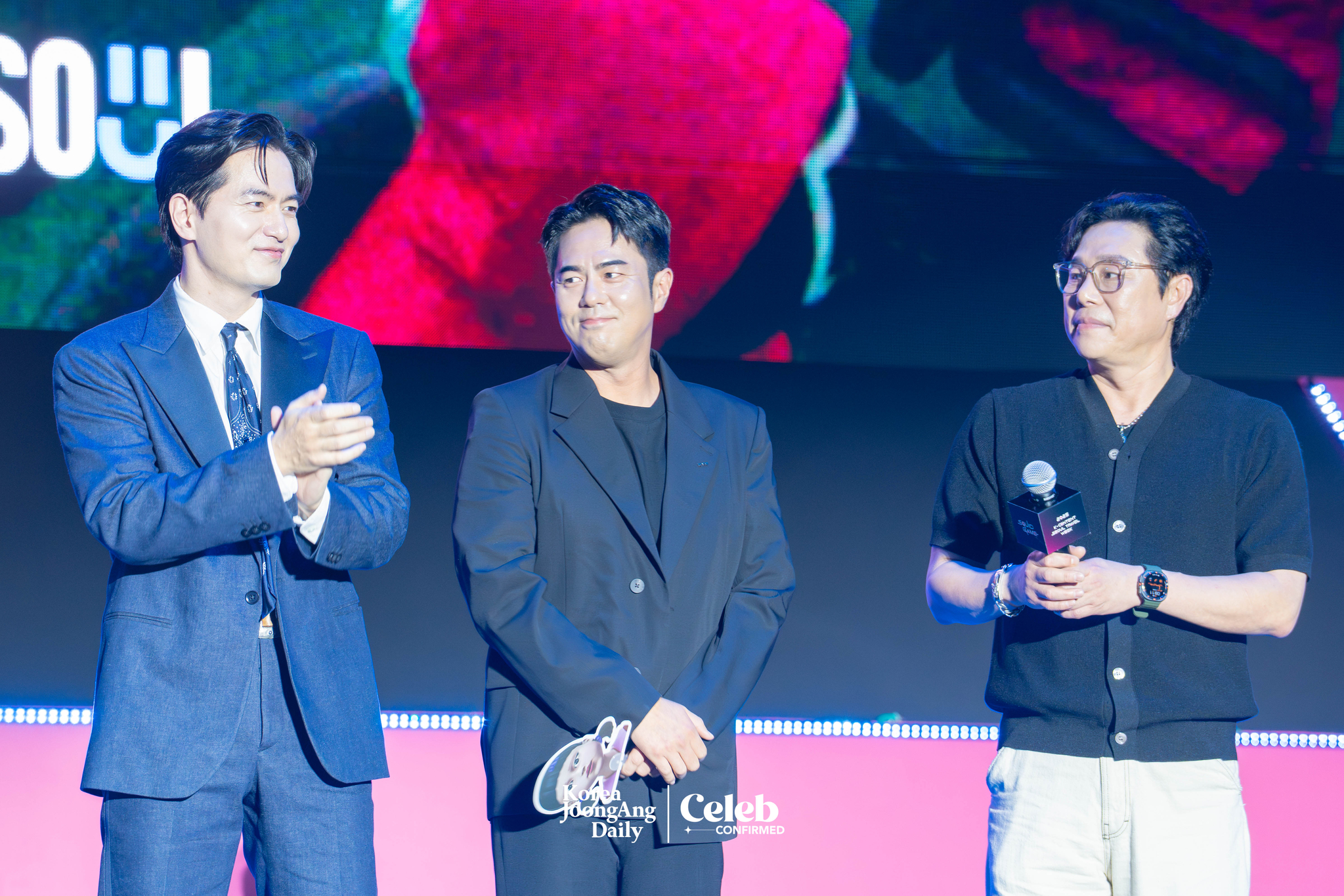 Actors Lee Jin-uk, Jun Suk-ho and Kim Pub-lae during a fan event for the release of the third season of “Squid Game” (2021-) at Seoul Plaza in central Seoul on June 28. [DANIELA GONZALEZ PEREZ]