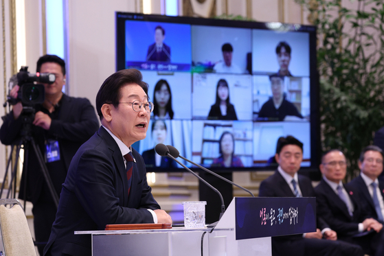 President Lee Jae Myung answers questions from reporters during his first official press conference marking 30 days in office at the state guesthouse of Cheong Wa Dae in Jongno District, central Seoul, on July 3. [JOINT PRESS CORPS]