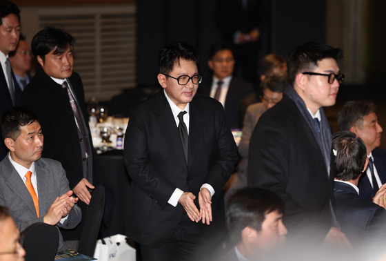 Bang Si-hyuk, founder and chairman of K-pop agency HYBE, second from the left, attends a conference held in Yeongdeungpo District, western Seoul, on Feb. 20. [YONHAP]