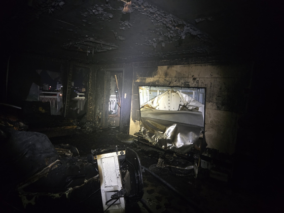 The remains of an apartment unit in Gijang, Busan, after a fire broke out at 10:58 p.m. on July 2. [YONHAP]