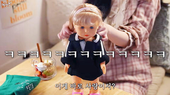 A scene from a YouTube vlog entry by creator Soyo, who taped her phone to a doll to make her conversations with ChatGPT more lifelike [SCREEN CAPTURE]