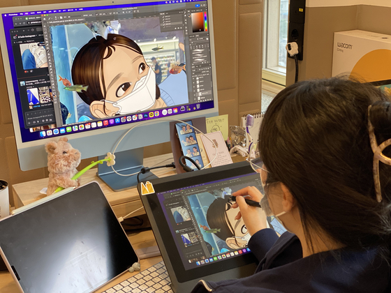 An illustrator at Scatter Labs works on artwork for the AI chatbot iLuda [SCATTER LABS]