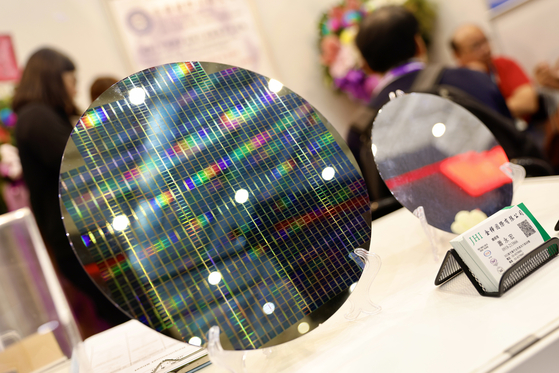 A silicon wafer on display during the SEMICON Taiwan, at Nangang Exhibition Center in Taipei, Taiwan, on Sept. 4, 2024. SEMICON Taiwan is an annual event focused on the semiconductor industry, offering exhibitions and conferences. It's a key platform in Taiwan for professionals to showcase innovations, network, and discuss the latest trends and advancements in semiconductor technology. [EPA/YONHAP]
