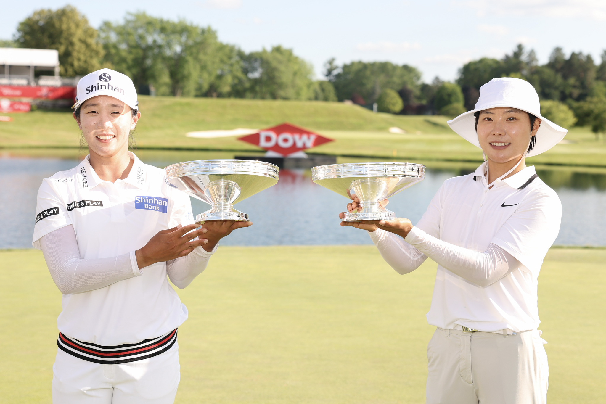 Im Jin-hee and Lee So-mi pose with their trophies after the final round of the Dow Championship 2025 at Midland Country Club in Midland, Michigan on June 29.  [GETTY IMAGES]