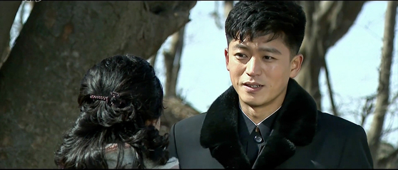 Kyong-mi and Young-deok, lovers in the North Korean drama “A New Spring in the Field of Manchurian Cranes” talk with each other in a scene aired by Korean Central Television. [KOREAN CENTRAL TELEVISION]