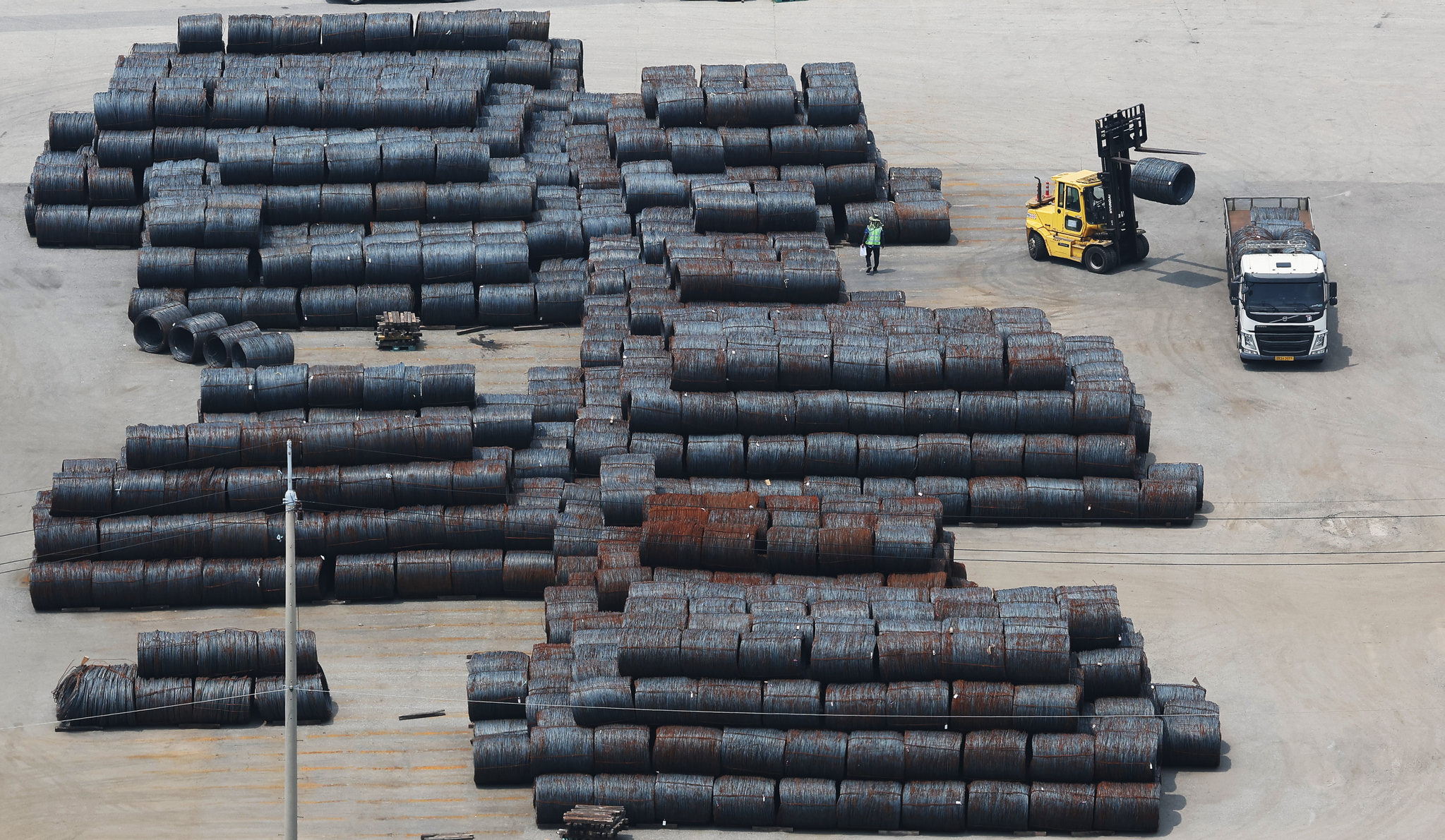Steel products are stacked at Pyeongtaek Port in Gyeonggi on July 7. [YONHAP]