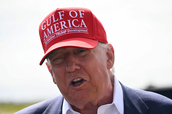 U.S. President Donald Trump speaks to reporters after arriving at Dade-Collier Training and Transition Airport in Ochopee, Florida, on July 1. Canada will face a 35 percent tariff on exports to the United States starting Aug. 1, President Donald Trump said on July 9 in a letter to Prime Minister Mark Carney. [AFP/YONHAP]