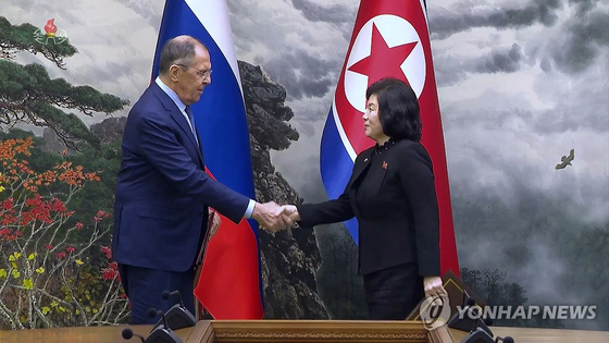 Captured from a broadcast of Korean Central Television, the picture shows Russian Foreign Minister Sergei Lavrov shaking hands with North Korean Foreign Minister Choe Son-hui as they meet for talks in Pyongyang on Oct. 19, 2023. [YONHAP] 