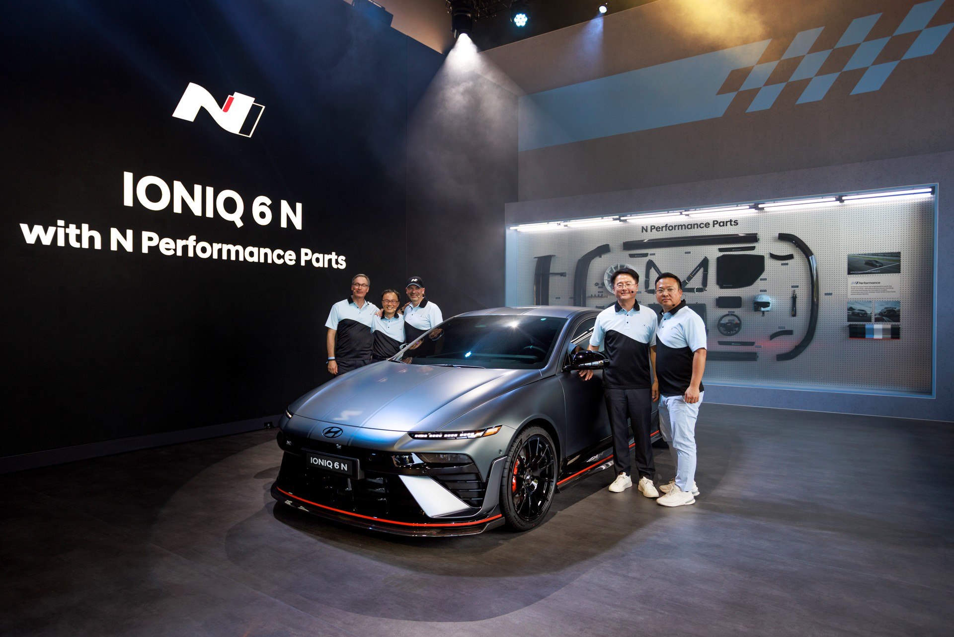 Hyundai Motor representatives stand next to the Ioniq 6 N, revealed at the 2025 Goodwood Festival of Speed in Britain on July 14. [HYUNDAI MOTOR]