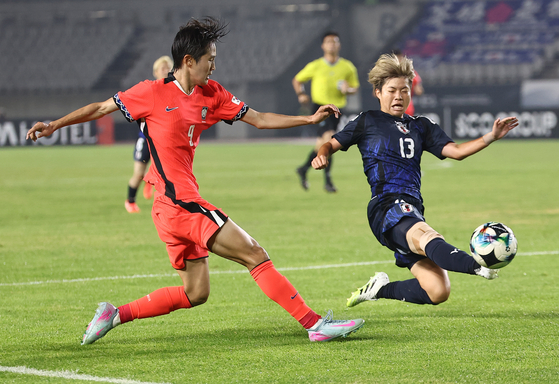 Jeong Da-bin of Korea, center, is congratulated by teammates Jang Selgi, left, and Ji So-yun after scoring against Japan during the teams' second match of the East Asian Football Federation E-1 Women's Football Championship at Hwaseong Stadium in Hwaseong, Gyeonggi, on July 13. [YONHAP] 